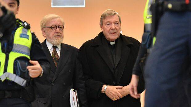 Cardinal Pell, with his lawyer Robert Richter, QC (left), arrives at Melbourne Magistrates Court. Photo: Joe Armao, Fairfax Media.