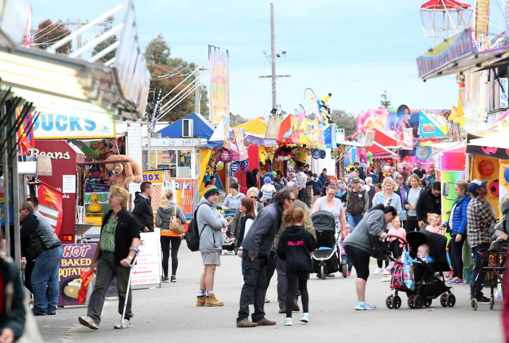 DAY OUT: Families flock to the Bendigo Show, which offers a family package for two adults and two children. Greater Bendigo was home to 5963 couple families with children under 15 during the 2011 Census. Picture: GLENN DANIELS