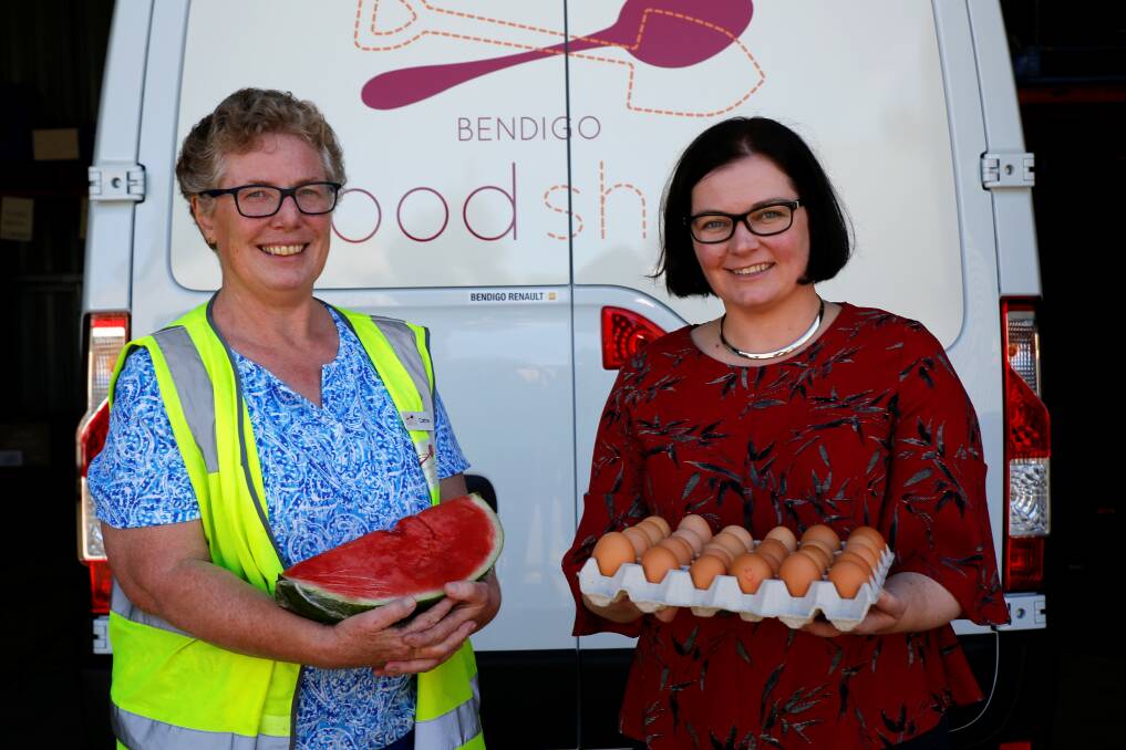 Bendigo Foodshare chair Cathie Steele and Member for Bendigo Lisa Chesters with the new refrigerated van. Picture: EMMA D'AGOSTINO
