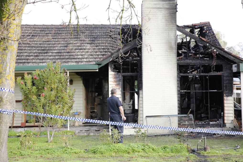Fire investigators attending the scene of a house fire in Kangaroo Flat on Tuesday. Picture: EMMA D'AGOSTINO