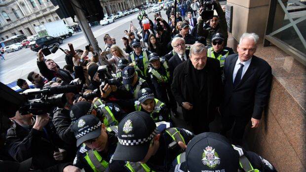The Cardinal arrives at Melbourne Magistrates Court with his lawyers Paul Galbally (right) and Robert Richter, QC. Photo: Joe Armao, Fairfax Media.