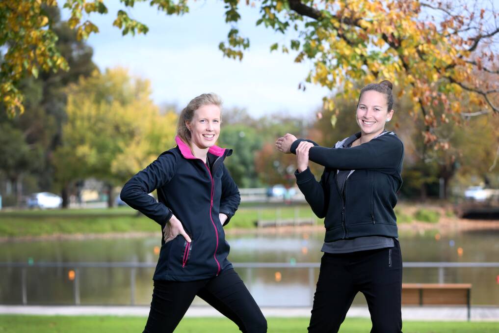 ME-TIME: Sports Focus project coordinators Stacey Keller and Natalie Lake warming up for a series of free activities for women. Picture: GLENN DANIELS