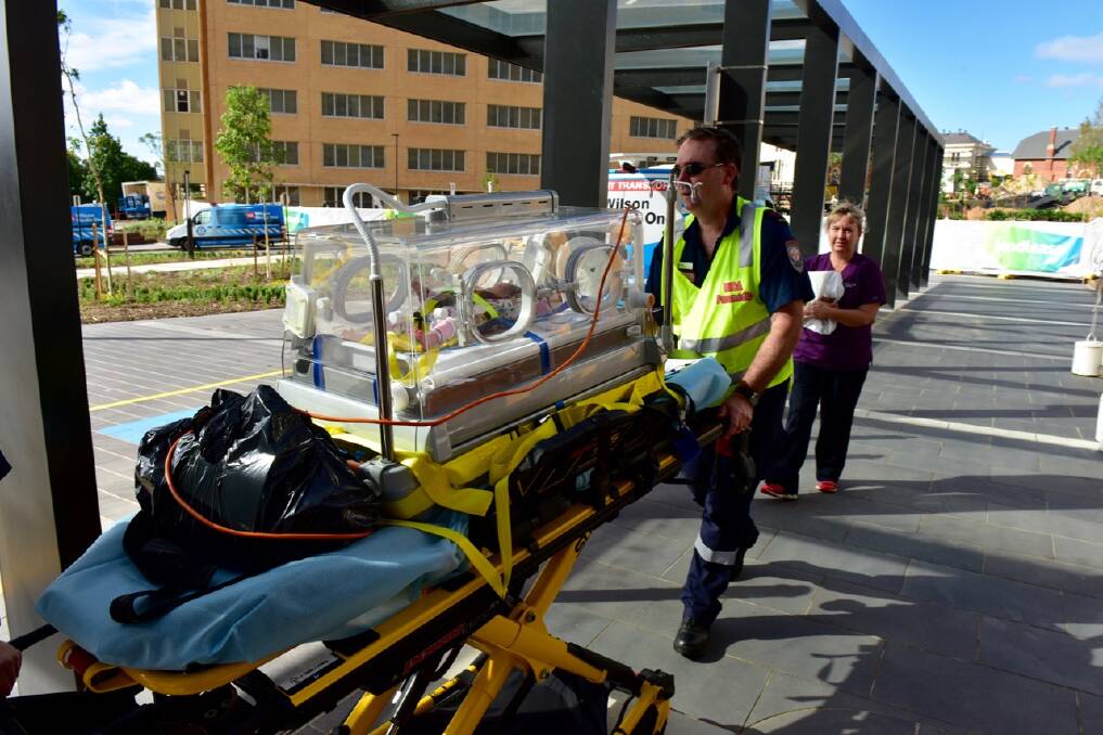 A MICA paramedic wheels a baby to the Special Care Nursery at the new Bendigo Hospital. The nursery, on the third floor, contains 15 special care cots. Picture: CONTRIBUTED