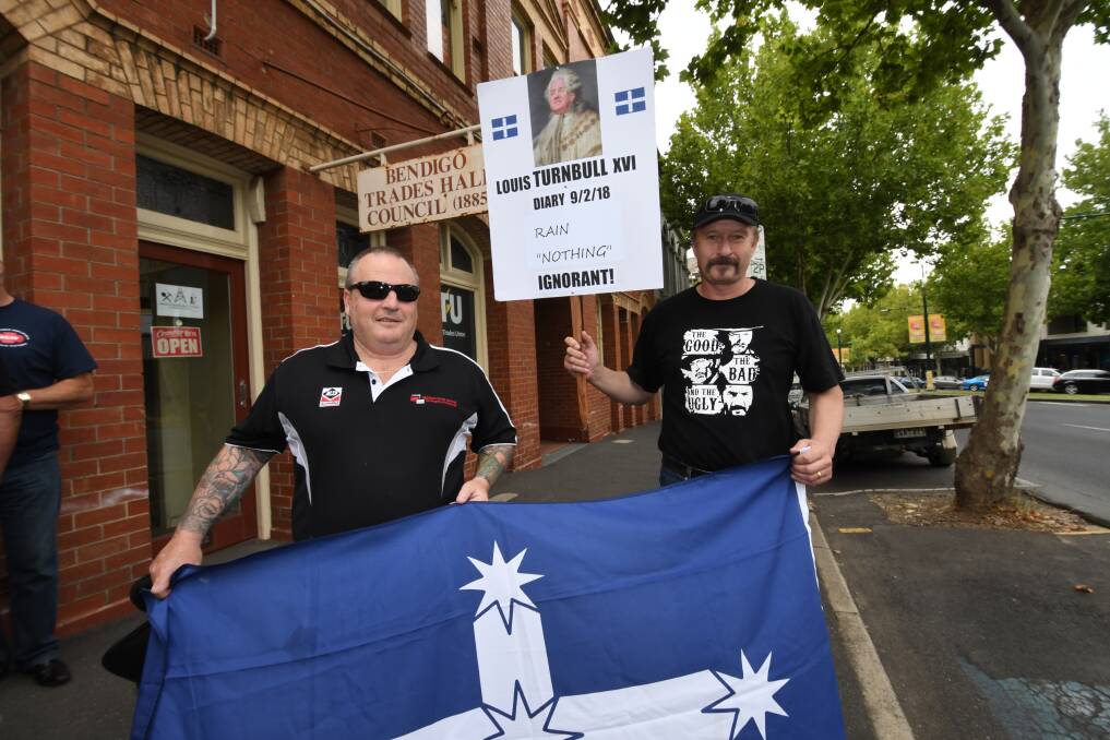 United Union members Rob Drummond and Peter Watkinson with an inventive sign. Picture: NONI HYETT