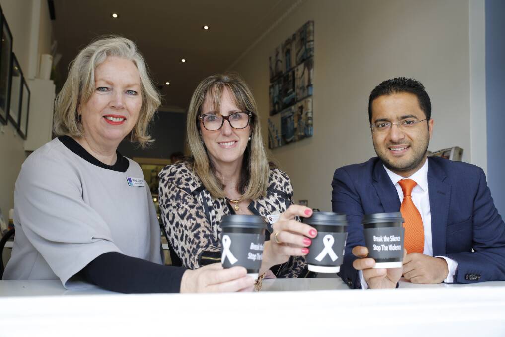 Women's Health Loddon Mallee executive officer Tricia Currie, City of Greater Bendigo mayor-elect Margaret O'Rourke and Bendigo TAFE's Abhishek Awasthi have a cup of coffee to raise awareness of White Ribbon Day.