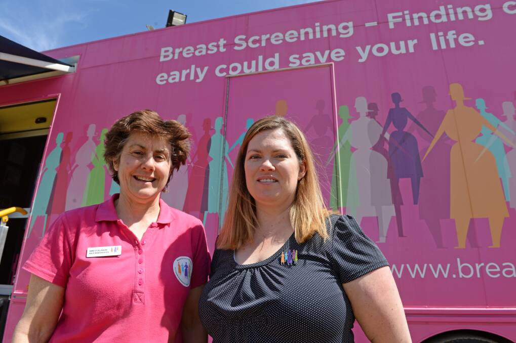 BreastScreen Victoria health promotion officer Anne O'Callaghan and radiographer Martine Silcox with Marjorie the Mobile Screening Service. Picture: DARREN HOWE