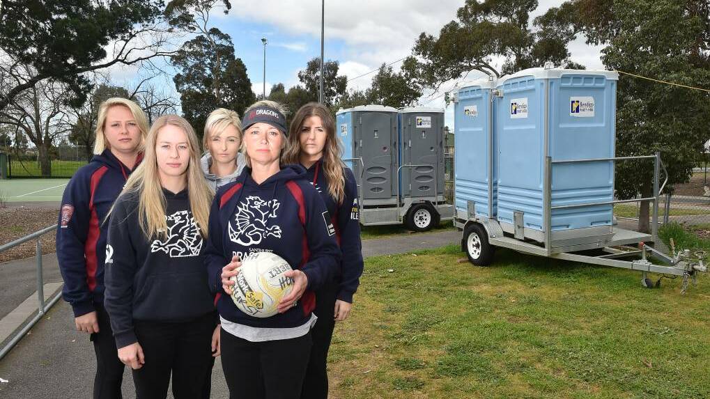 Emma Tindill, Cath Robertson, Gabriella Greene, Jenna Sing and Carly Van Den Heuvel with the temporary facilities used during the finals at the Queen Elizabeth Oval. Picture: NONI HYETT