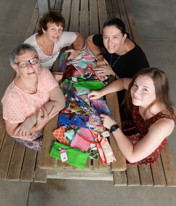 CARING HANDS: The Hailey Project was inspired by Swim and Survival Academy manager Hailey Eeles, back right, with founder Eliza de Kort, front right, and helpers Joan Neil, front left, and Pam Clark. Picture: Kate Healy