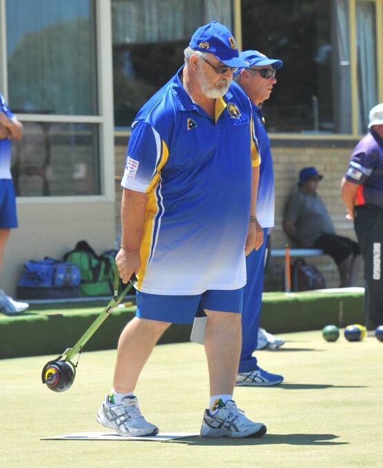 ON THE MAT: Golden Square's Guenther Ebenwaldner bowls in Saturday's four-shot victory over Bendigo in the return of the BBD pennant season. Pictures: LUKE WEST