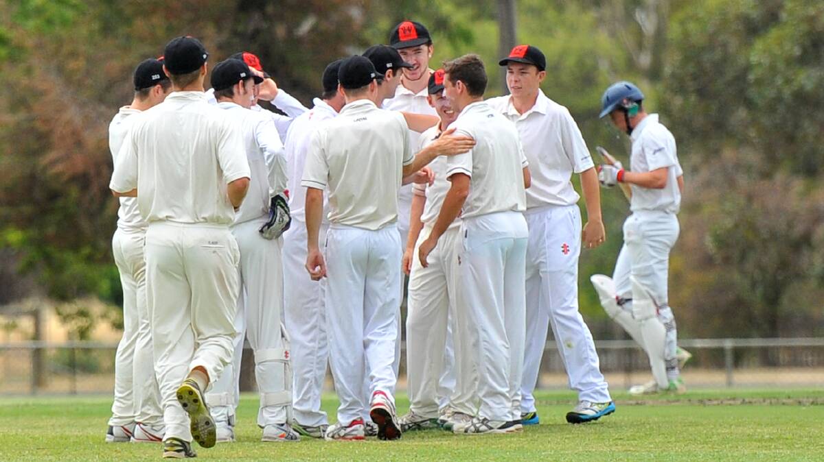 White Hills players celebrate an early wicket on Saturday. Picture: LUKE WEST