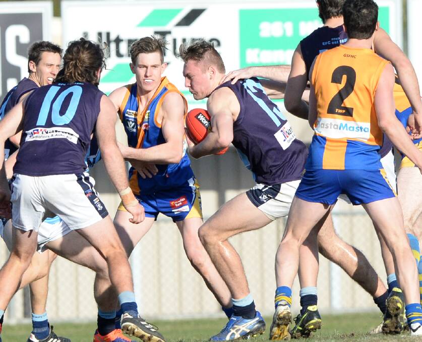 CRASHING THROUGH: Eaglehawk ruckman Jonty Neaves played a fine game in Saturday's 26-point victory over Golden Square at Wade Street. The Hawks had trailed by 29 points during the third quarter and are now in top spot. Pictures: DARREN HOWE