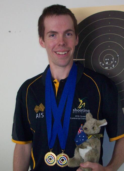 ON TARGET: Gary Mullens with his two gold medals.