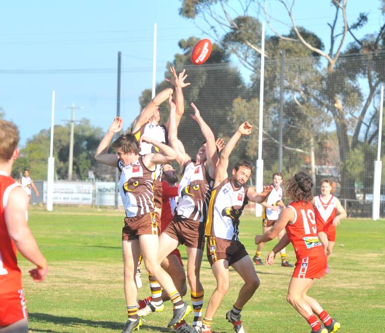 CONTEST: The pack flies during Saturday's clash between Elmore and Huntly. The Hawks won 21.20 (146) to 6.10 (46) and are now fourth. Pictures: ADAM BOURKE