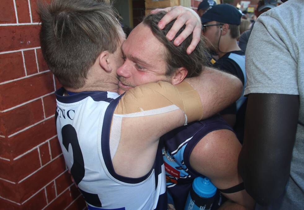 GUTTED: Eaglehawk coach Josh Bowe is consoled by Strathfieldsaye co-captain Shannon Geary after Saturday's presentation. Bowe was one of the Hawks' best players in their 32-point loss. Picture: GLENN DANIELS