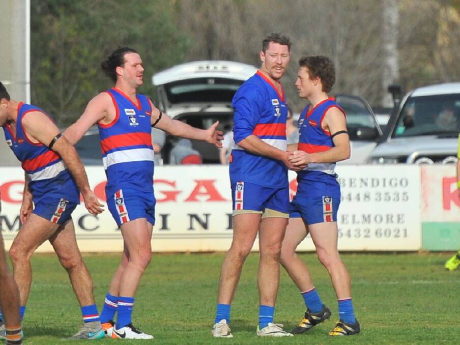SUPERBOOT: Full-forward Sam Barnes is congratulated after bagging his 10th goal for North Bendigo in the final term against Huntly on Saturday.