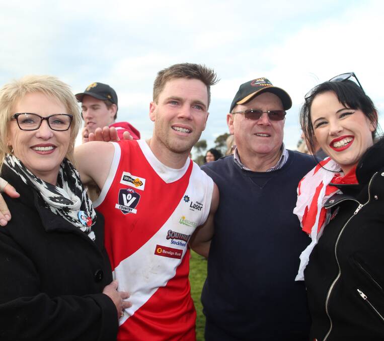 SPECIAL DAY: Bridgewater premiership coach Marc Lindsay, who has played in five flags, with parents Mary and Jeff and sister Nicole.