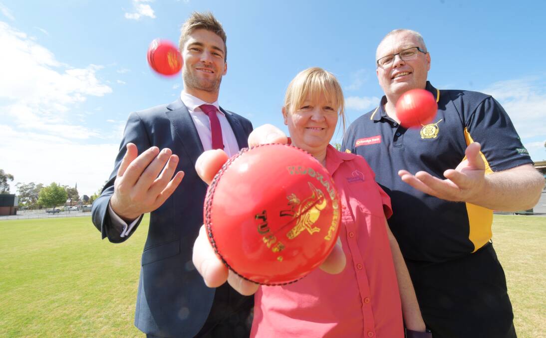 FRESH LOOK: Kookaburra's Shannon Gill, McGrath Foundation nurse Rosie Gillies and BDCA vice-president Rob Bakes with some of the pink balls.
