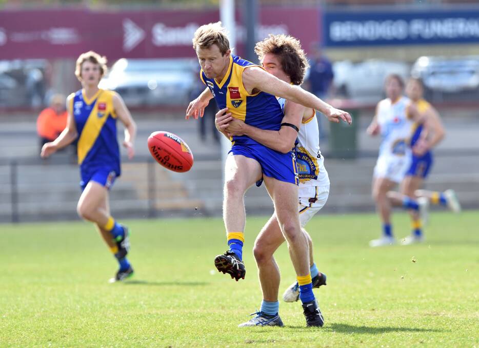 DETERMINED: Heathcote District's Tom Hill gets a kick away at the QEO on Saturday against Central Murray in the first quarter. Picture: GLENN DANIELS