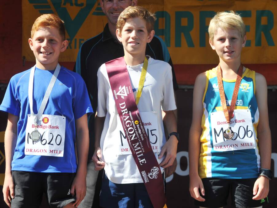 MEDALISTS: Jayden Padgham, Luke Salvador and Harrison Boyd after the Year 5 and 6 Dragon Mile race.