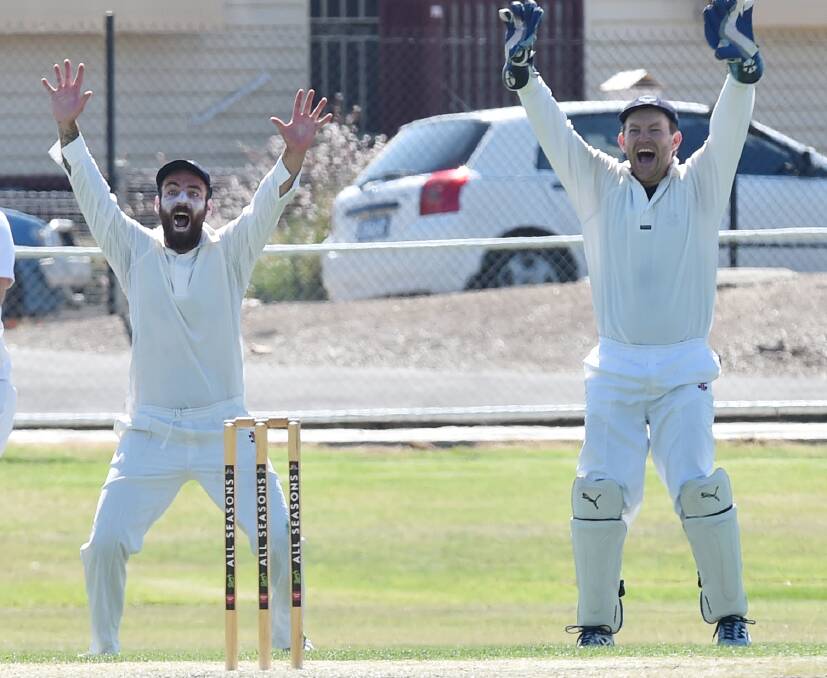 HOWZAT: Eaglehawk's Josh Collinson and wicket-keeper Matt Fitt appeal for a wicket against Strathdale-Maristians in their BDCA semi-final on Saturday. The Hawks are through to their second grand final in a row. Pictures: DARREN HOWE