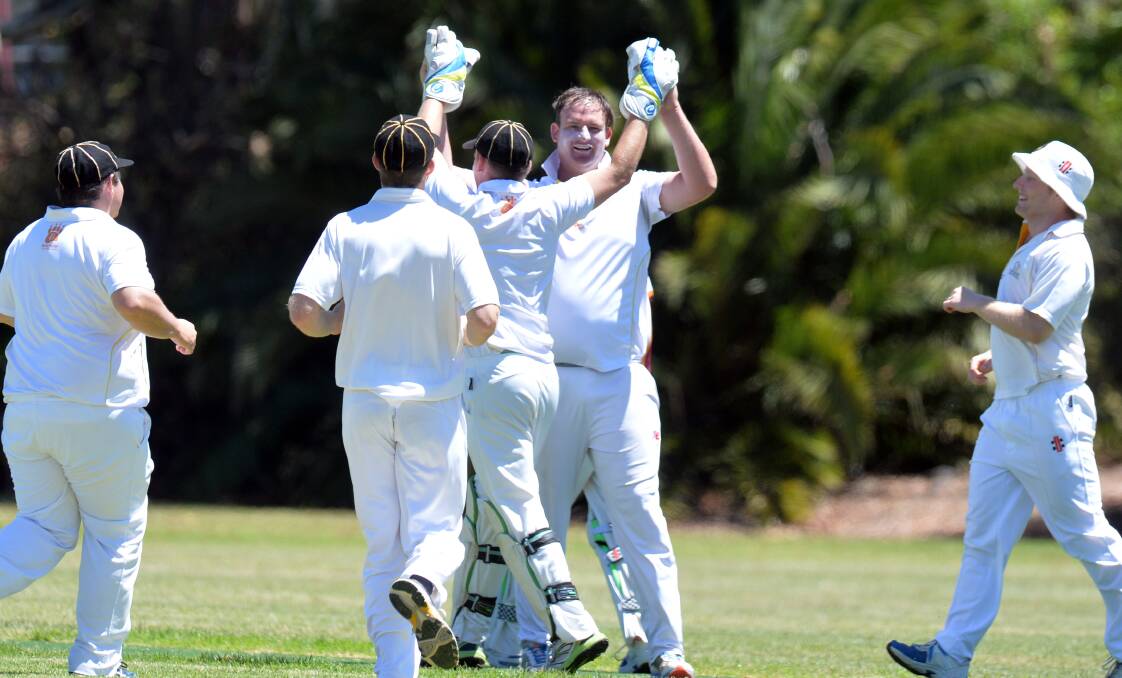 GET AROUND HIM: United celebrates one of Alex Collins' three wickets against Maiden Gully at Ewing Park on Saturday. Picture: GLENN DANIELS