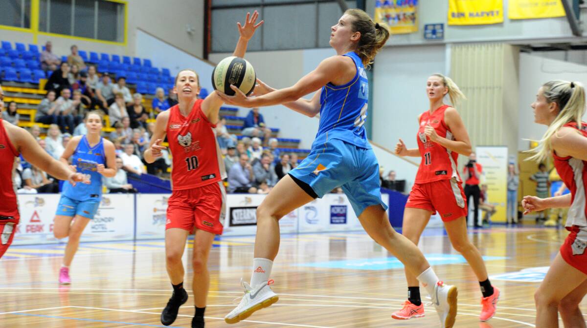 DRIVE: Bendigo Spirit point guard Blake Dietrick attacks the basket in Sunday's thrilling 73-72 win over the Perth Lynx at the Bendigo Stadium. The Spirit end the season sixth with a 13-11 record. Picture: NONI HYETT