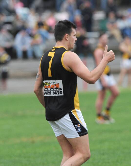 THUMBS UP: Kyneton forward Mitch Scholard kicked five goals in the Tigers' 21-point win over Sandhurst. The Tigers are now one game clear of the Dragons inside the top five after 13 rounds. Picture: NONI HYETT