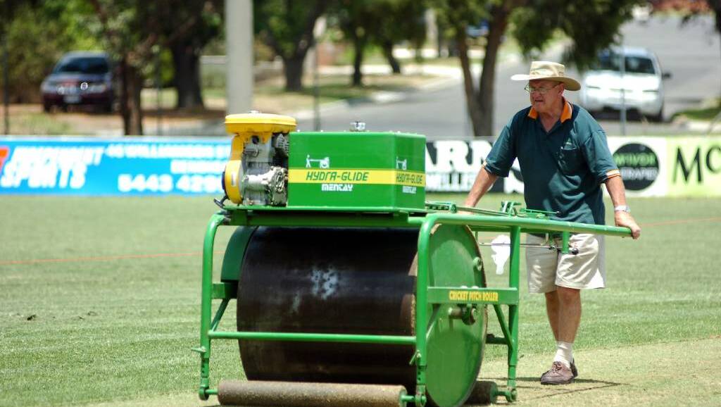 Former Bendigo United curator Peter Behrens with the club's roller.
