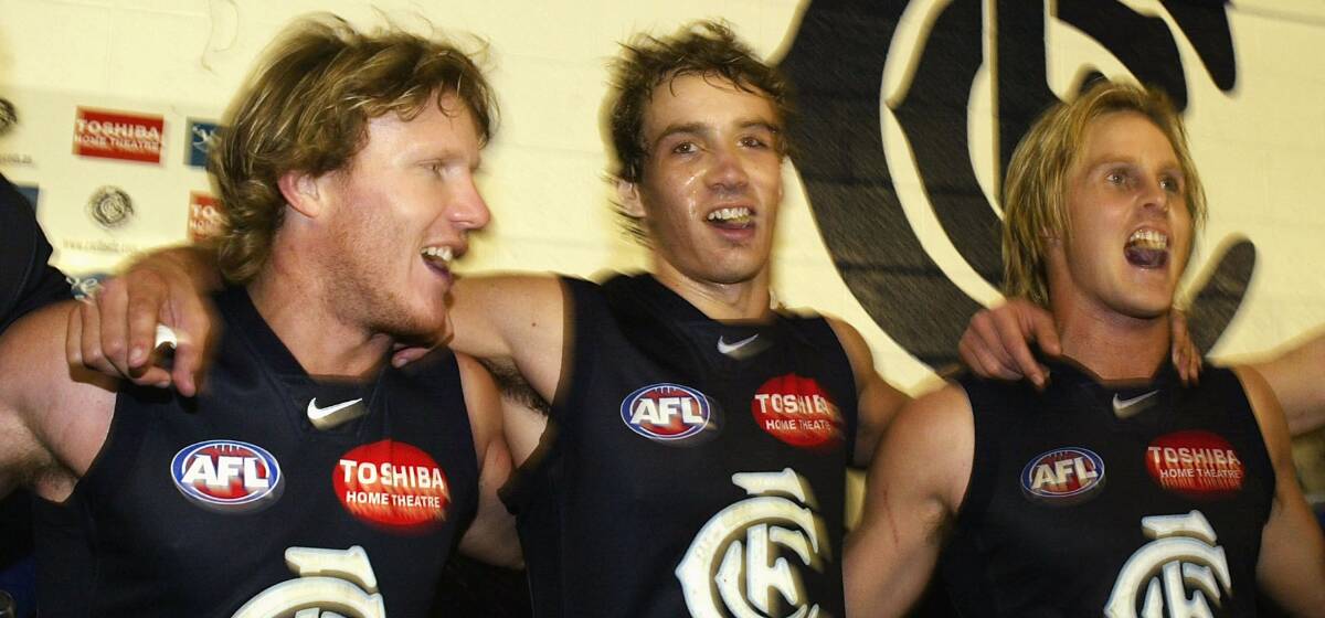WHAT A DEBUT: Andrew Walker is flanked by Glen Bowyer and David Teague after beating the West Coast Eagles in his first AFL game in round five, 2004.