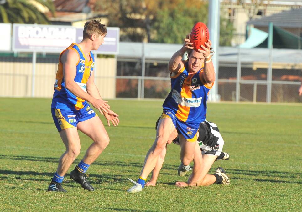 Golden Square's Jack Geary marks against Castlemaine. Picture: LUKE WEST