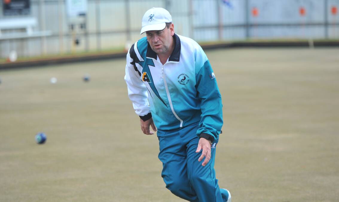 INTENSE: Bendigo East skipper David "Crackers" Keenan follows down one of his bowls against Kangaroo Flat on Saturday. The reigning premier was in devastating round one form, winning by 57 shots. Pictures: LUKE WEST