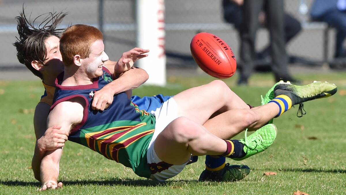 WRAPPED UP: CCB'S Daniel Clohesy is going nowhere in this tackle at the QEO on Wednesday.