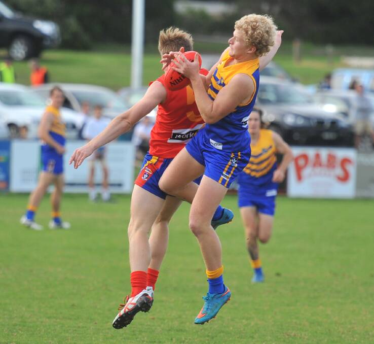 GOOD GRAB: Heathcote District's Harry Whittle outmarks Bellarine's Jacob Sharp in the first quarter on Saturday. Bellarine was victorious by 80 points at Ocean Grove's Shell Road Recreation Reserve. Pictures: LUKE WEST