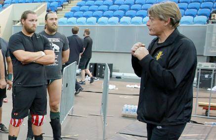 MEMORABLE DAY: Bendigo's Cadman Turner listens to WWE coach and scout William Regal at Thursday's try-out in Melbourne. Picture: WWE.COM