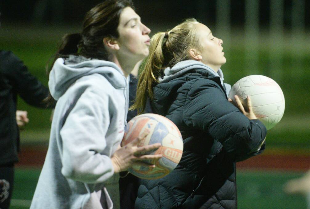 GEARING UP: Wedderburn's netballers go through their paces at training on Thursday night. Picture: DARREN HOWE