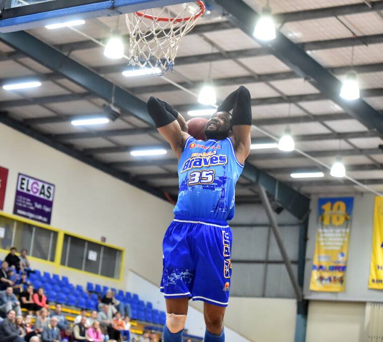 SHOWTIME: Bendigo Brave Damian Johnson hammers down a slam dunk in Sunday's victory.