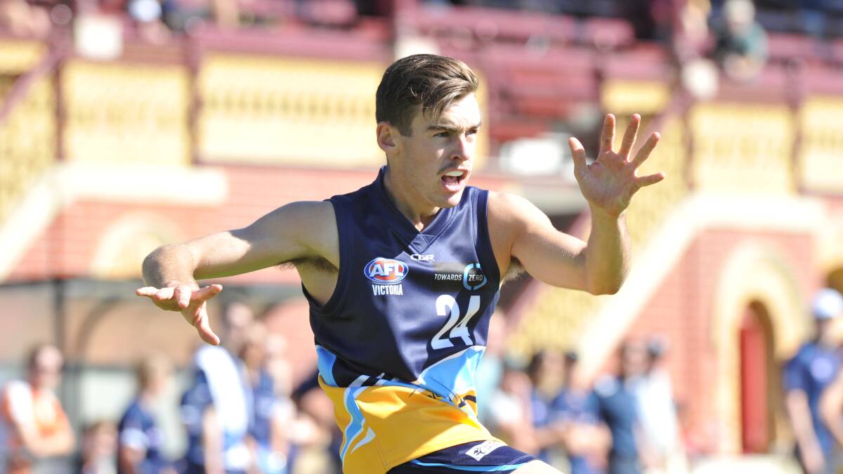 KICK IT LONG: Brady Hore, who was among the best, sends the Bendigo Pioneers forward. The Pioneers blew a 28-point half-time lead against Gippsland.