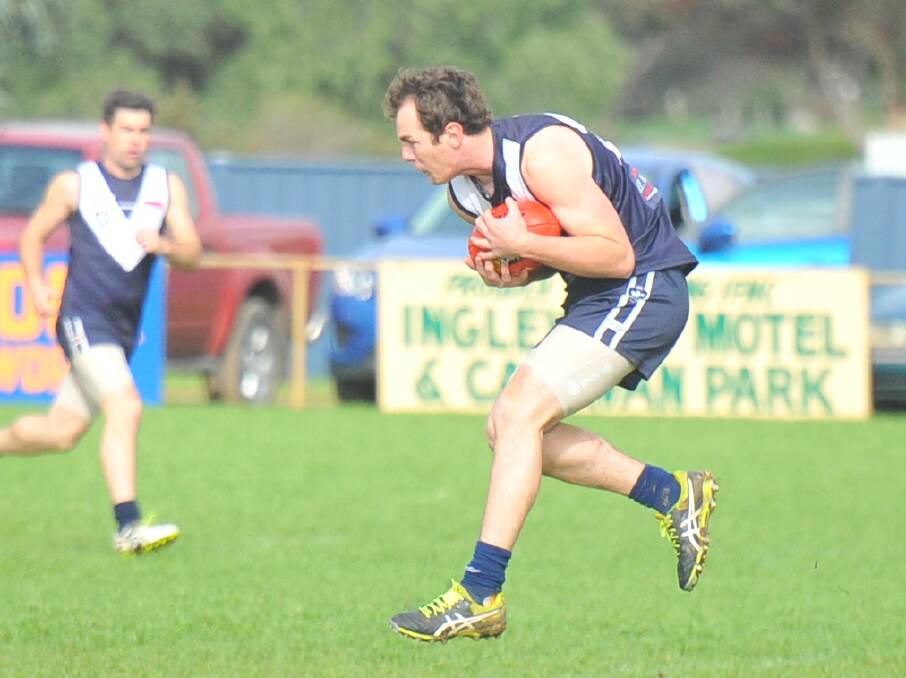 SAFE HANDS: Inglewood skipper Sam Williams marks early in Saturday's eight-point loss to YCW. Williams kicked three goals for the Blues.