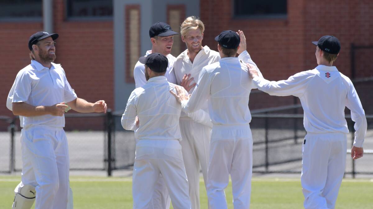 UP AND ABOUT: Eaglehawk players celebrate one of Richard Tibbett's five wickets against Strathdale-Maristians at the QEO on Saturday. Picture: GLENN DANIELS