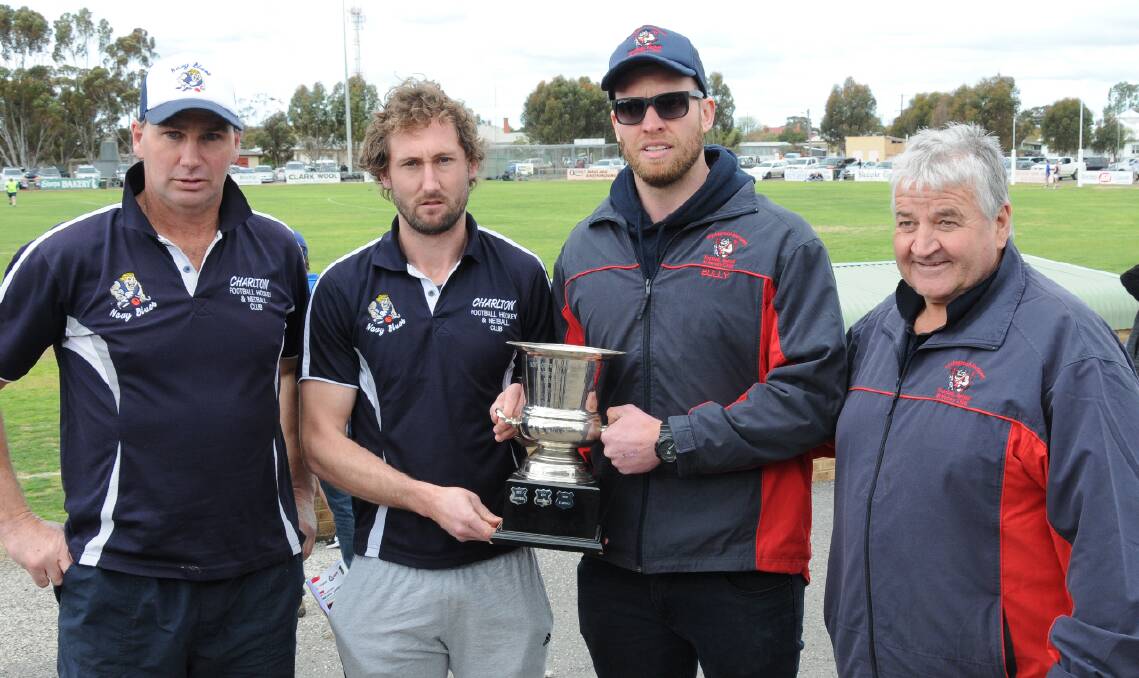 SET FOR BATTLE: Charlton president Shane Fitzpatrick and coach Aaron Walklate with Wycheproof-Narraport coach Julian Bull and president Trevor Allan and the NCFL premiership cup. Picture: SHANE O'SHEA, BULOKE TIMES