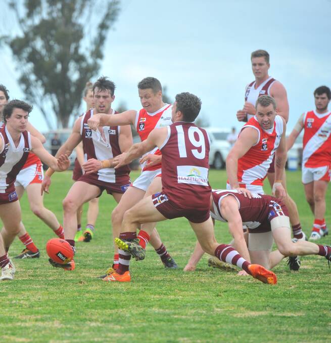 DOWN TO THE WIRE: Fierce rivals Bridgewater and Newbridge played out a Loddon Valley league qualifying final thriller on Saturday. The Mean Machine won by two points after kicking the last three goals of the game in the final five minutes at a windy Mitiamo. Pictures: ADAM BOURKE