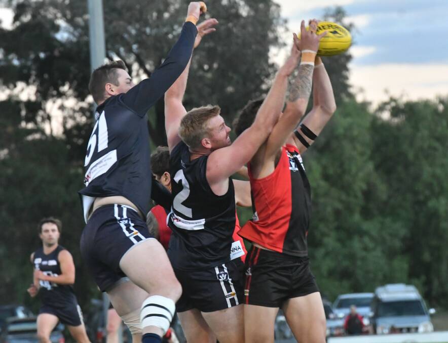 The pack flies at White Hills on Saturday night. Picture by Adam Bourke