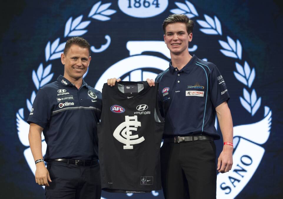 NEW BLUE: Carlton coach Brendan Bolton with No.3 draft selection Paddy Dow on Friday night. Picture: FAIRFAX MEDIA
