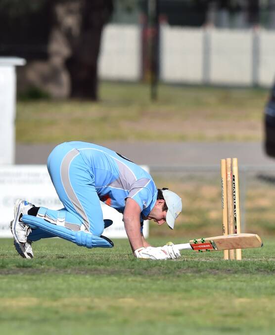 IN A TANGLE: Strathdale-Maristians' Adrian Pappin loses his footing in Tuesday night's Twenty20 loss to Bendigo. The Goers won by three wickets. Picture: GLENN DANIELS