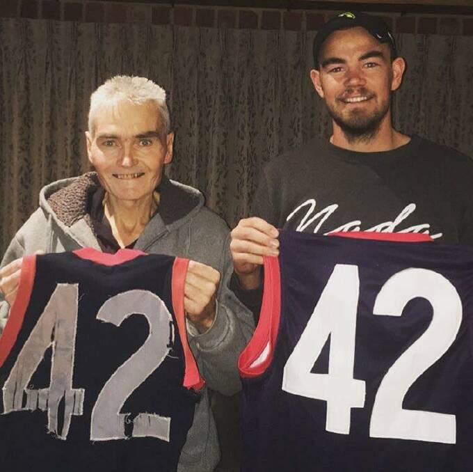 PRIZED POSSESSIONS: Owen and Bryce Curnow with their treasured No.42 Calivil United guernseys. This photo was taken less than a week before Owen passed away in April. Bryce will play for the Demons in Saturday's grand final.