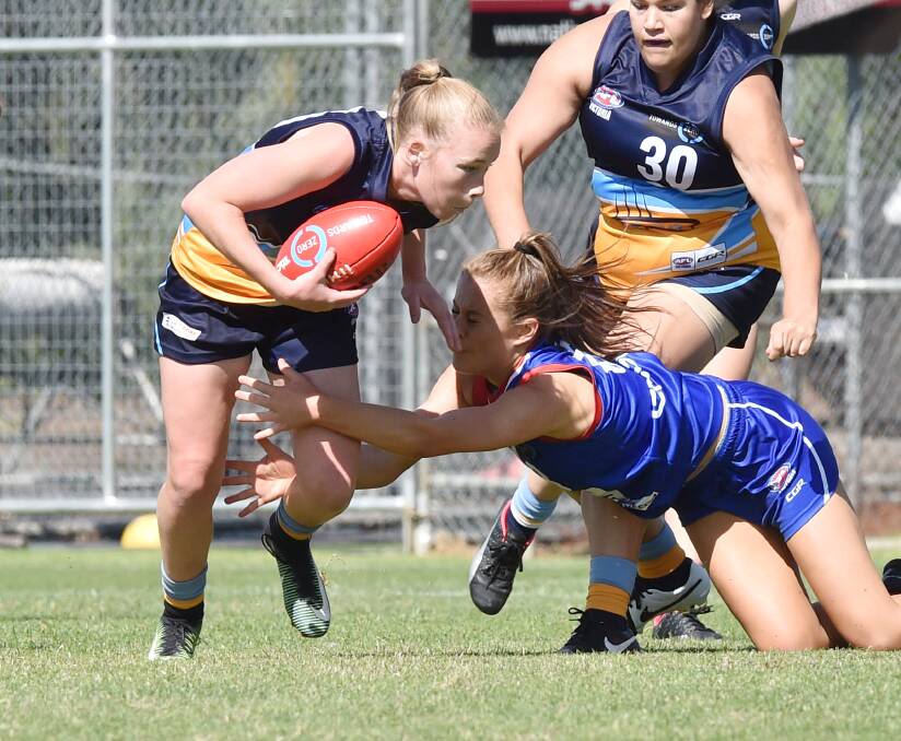 DETERMINATION: Bendigo's Kodi Jacques with possession of the ball during the Pioneers girls' 20-point victory over the Gippsland Power.
