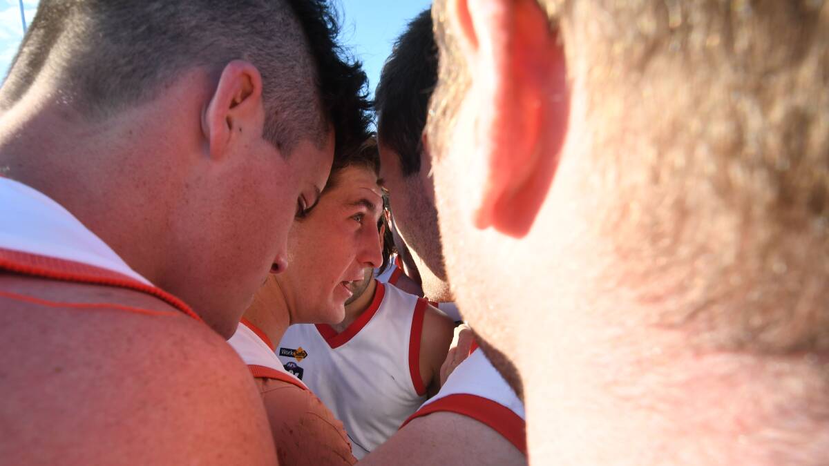 LEADER: Birchip-Watchem coach Tom Carland addresses his players at three-quarter-time. Picture: NONI HYETT