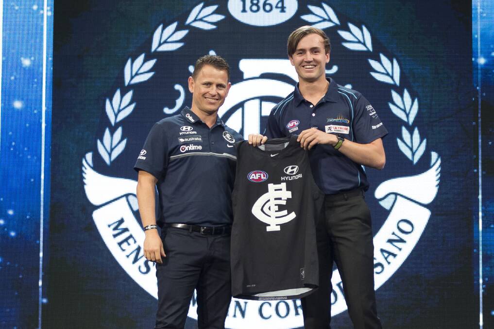 BOUND BY BLUE: Carlton coach Brendan Bolton with Lochie O'Brien, who was selected with pick 10. Picture: FAIRFAX MEDIA
