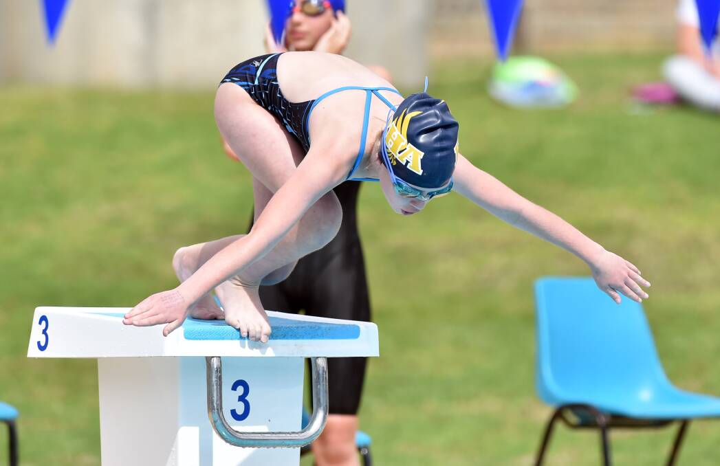 DIVE: Bendigo Hawks Aquatic Club member Keira Stevens, 10,  competes at the club's centenary swim meet last Sunday. Picture: GLENN DANIELS