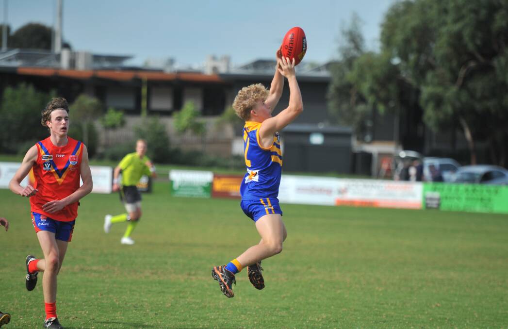 GOOD HANDS: Heathcote District's Olly O'Shea takes a mark during the third quarter against Bellarine at Ocean Grove on Saturday. Picture: LUKE WEST